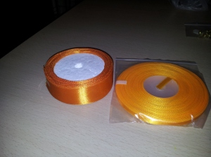 1.5" sunset orange ribbon £1.50, 1/2" sunset orange ribbon 50p (that's for the roll!)